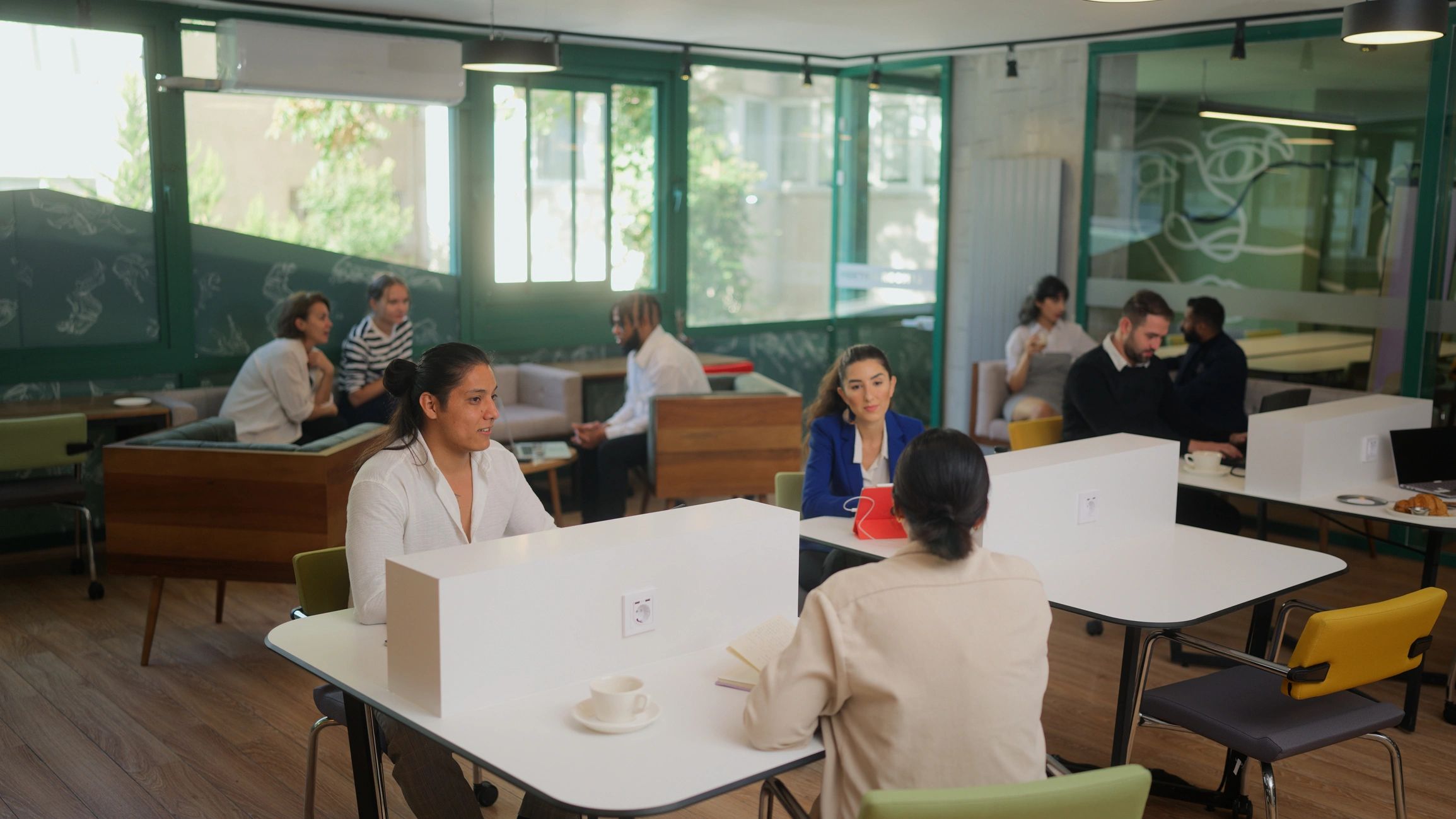 Professionals collaborating in a coworking cafe