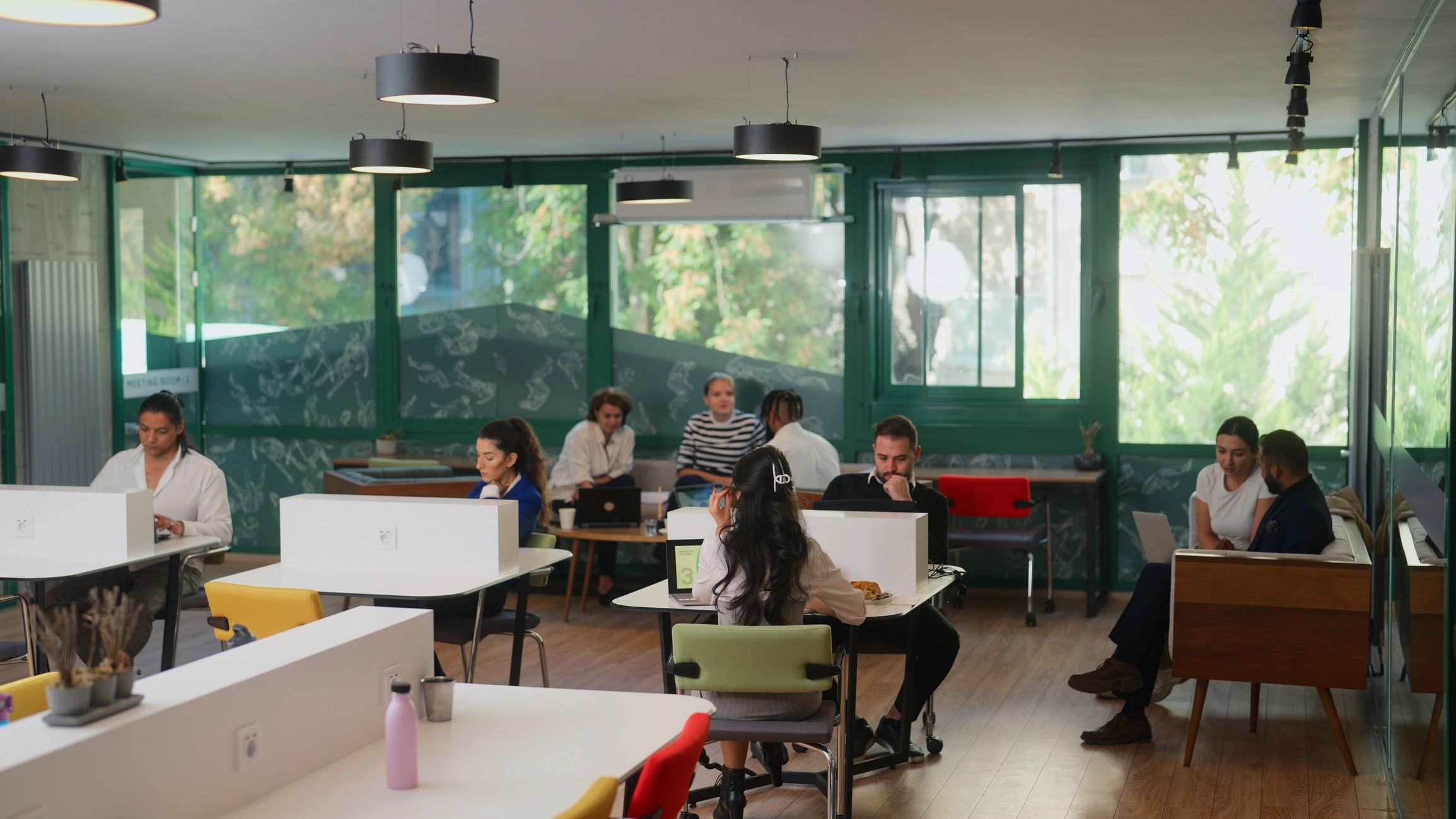 Coworkers collaborating in a bright modern workspace