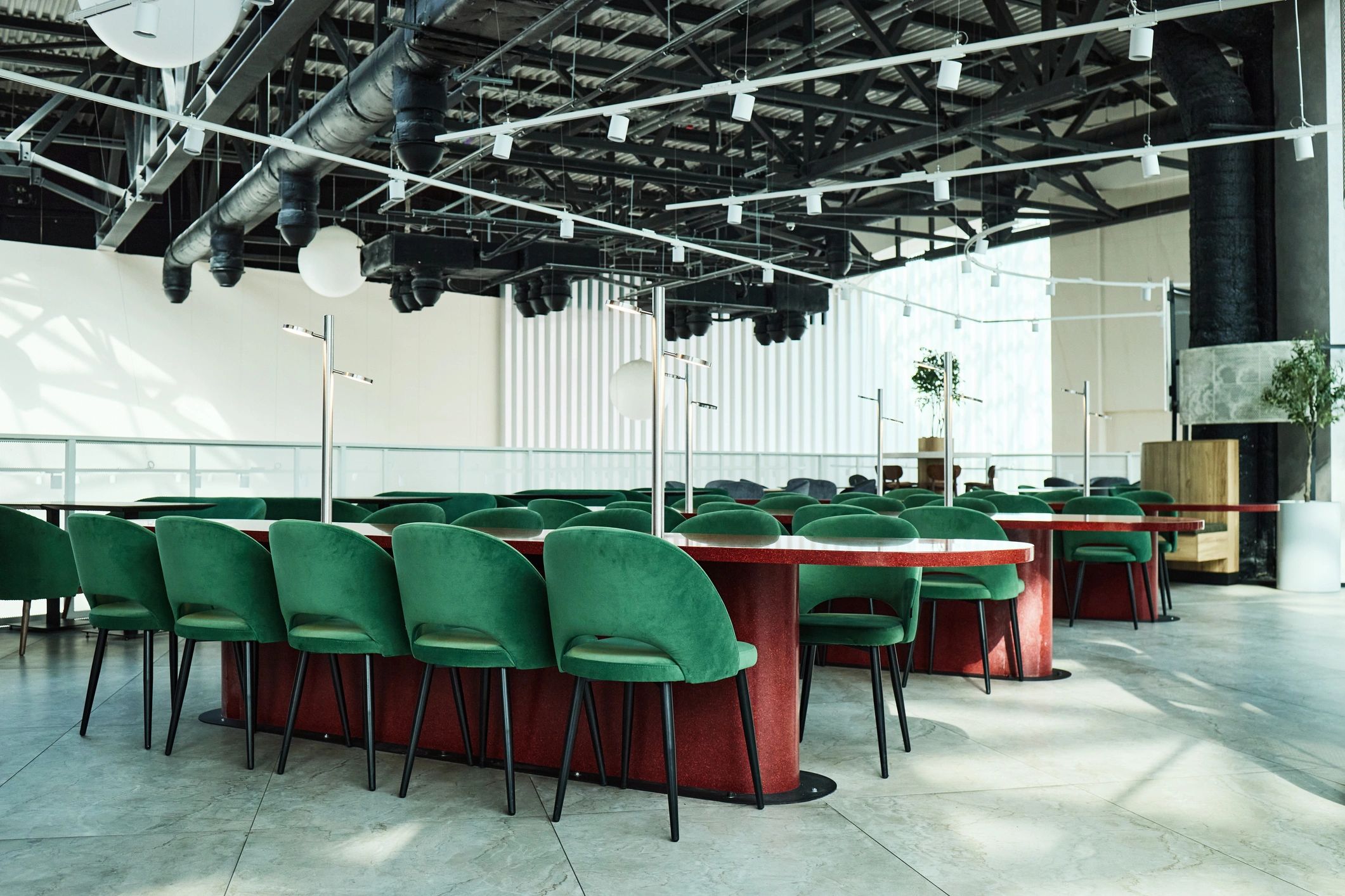 Modern coworking lounge with shared tables and seating